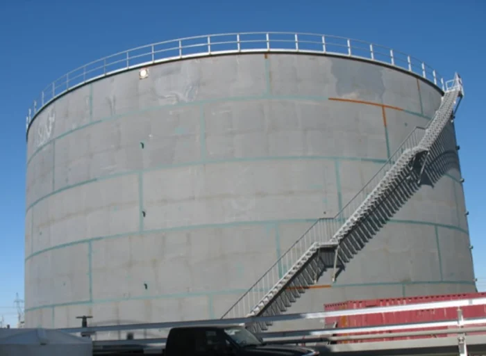 Storage tank with spiral access stairway, field services